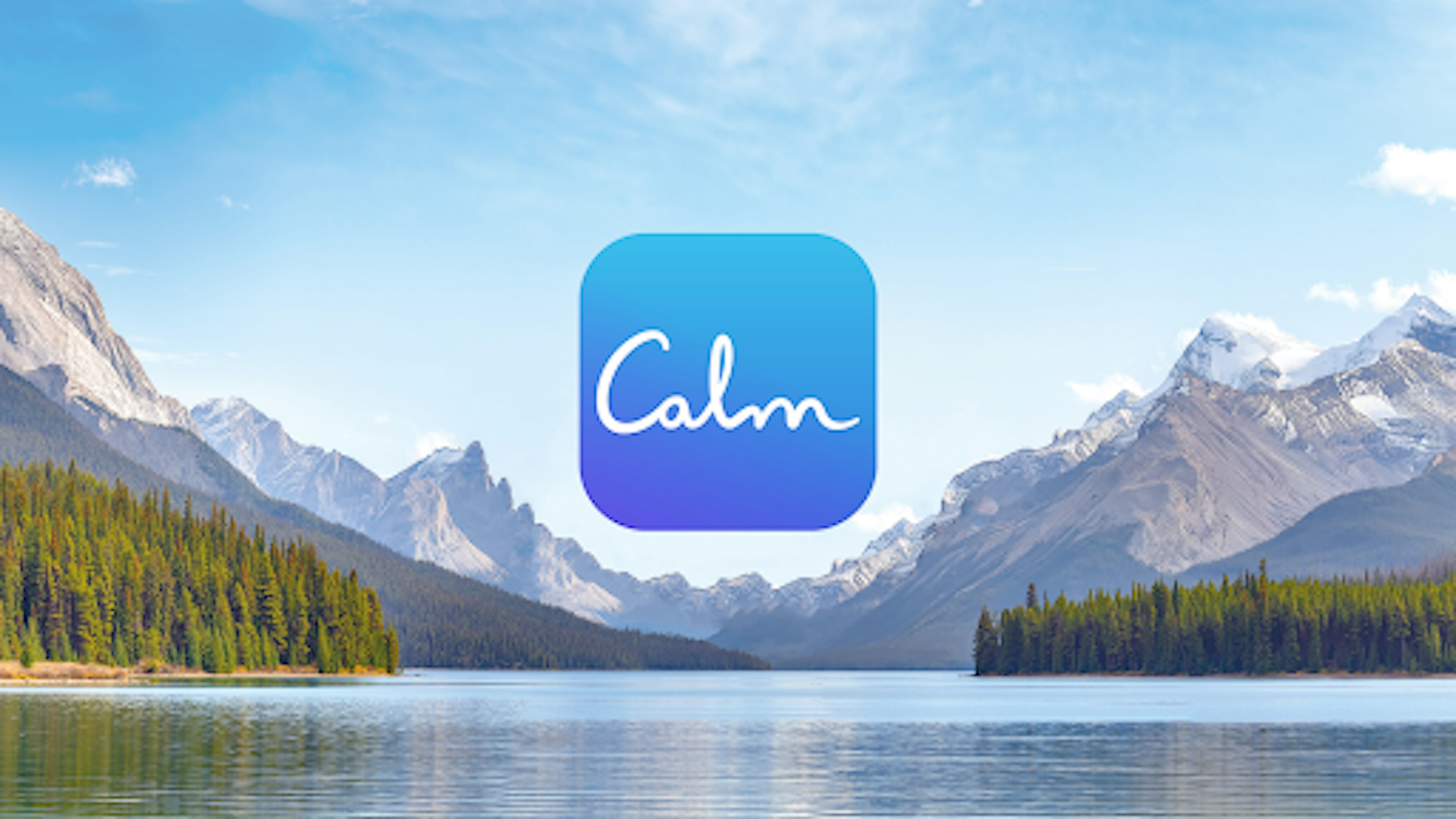  Image of a lake with trees and mountains in the background. The calm logo is in the middle of the image.